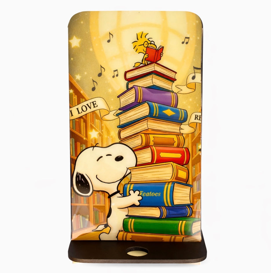 Soporte para teléfono con libros de Snoopy